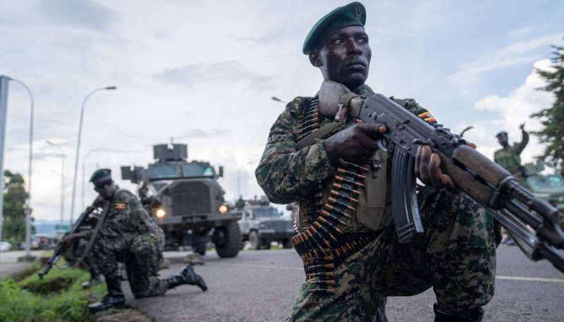 Members of the Ugandan People's Defence Forces (UPDF), positioned on the Ugandan side of the border town of Bunagana, in the DRC, in March 2023. 