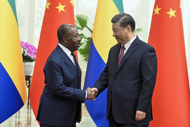 undefinedFormer Gabonese President Omar Bongo and his Chinese counterpart Xi Jinping, 19 April 2023, in Beijing.