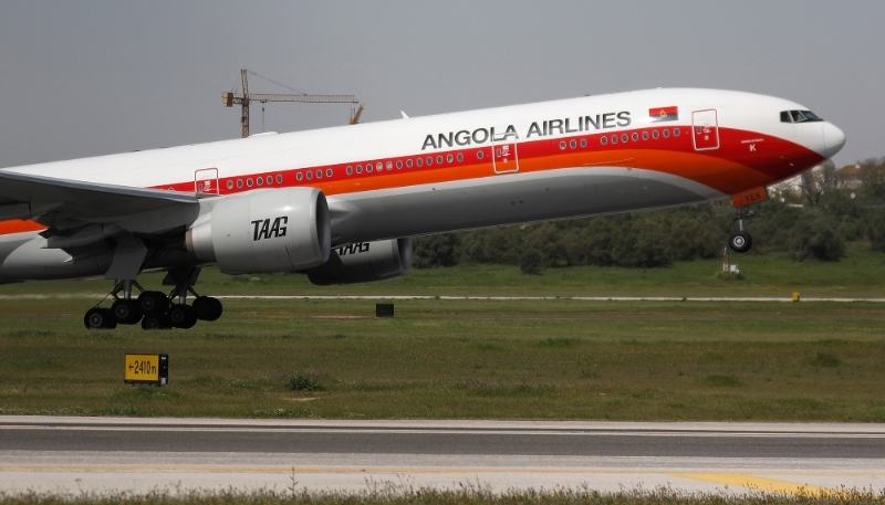 A TAAG Angola Airlines Boeing 777-300ER plane takes off from Lisbon airport in Portugal.