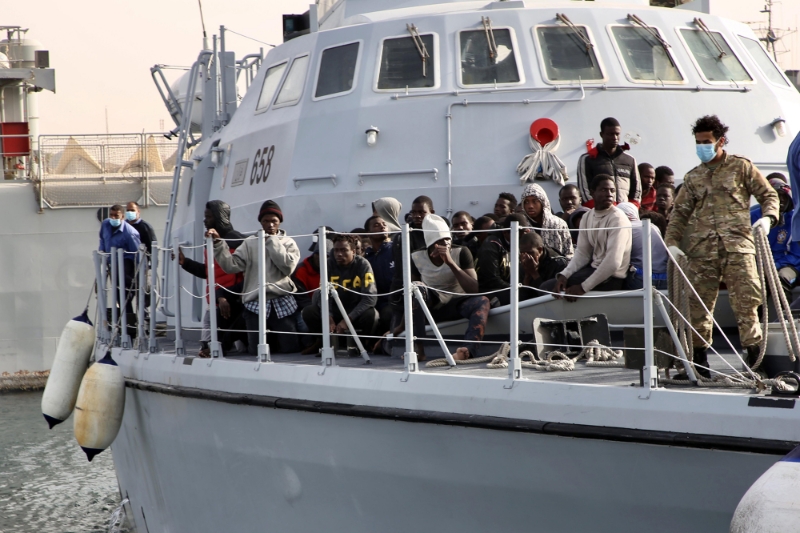 Migrants are seen on the deck of a Libyan Coast Guard's ship in Tripoli, Libya, on 29 April 29 2021.