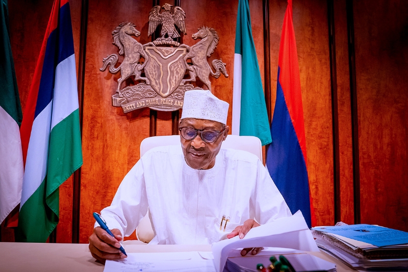 Nigeria's President Muhammadu Buhari signs Petroleum Industry Bill into law at the state house in Abuja.
