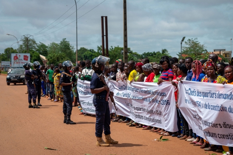 Supporters of Central African Republic President hold a banner during a demonstration to demand a change of the constitution on 29 April.