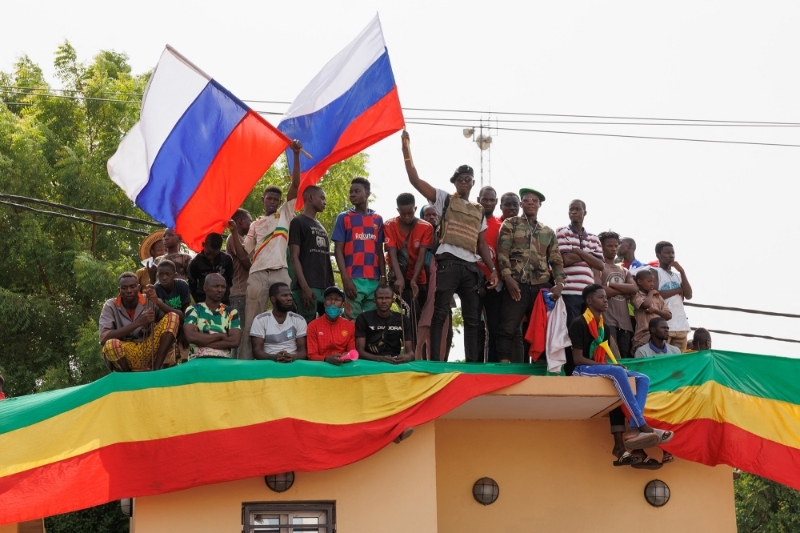 Supporters of the Malian Interim President wave Russian flags during a pro-Junta and pro-Russia rally in Bamako on May 13, 2022.