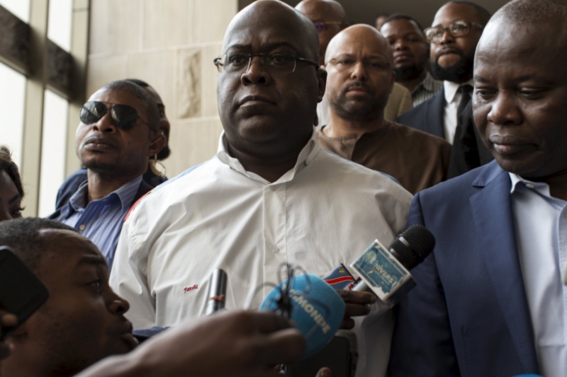 Congolese President Félix Tshisekedi (center) and his former fallen chief of staff Vital Kamerhe (right).