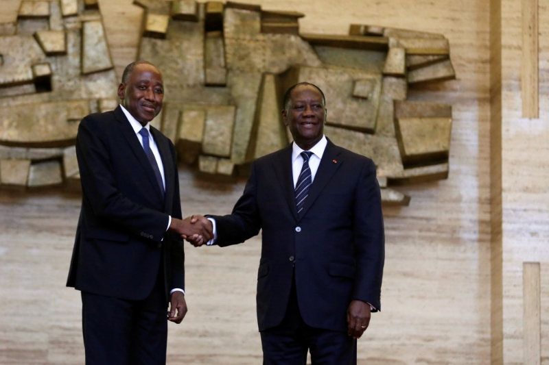 Amadou Gon Coulibaly (left) during his 2017 nomination, with Alassane Ouattara.