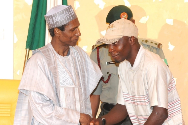 Tompolo, then MEND leader, in 2009, with Nigerian President Umaru Yar'adua, accepting amnesty.