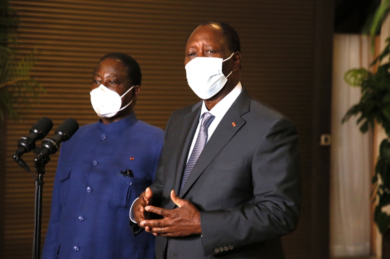 Alassane Ouattara (right) and Henri Konan Bédiémet on 11 November 2020.