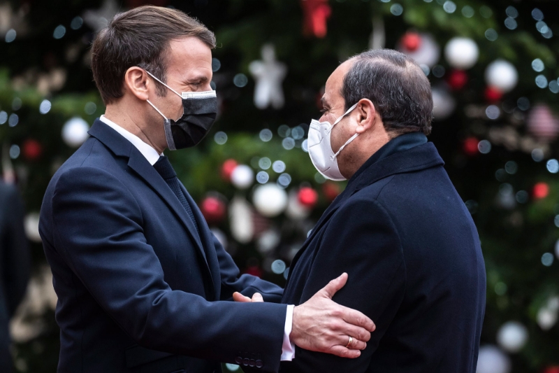 French president Emmanuel Macron and Egyptian president Abdel Fattah Al-Sisi upon his arrival for a meeting at the Elysee Palace in Paris on 7 December.