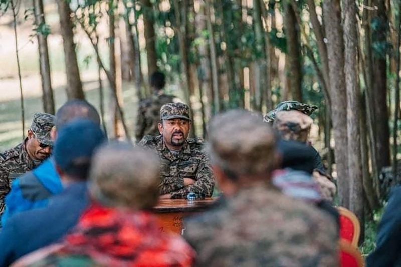 Ethiopian Prime Minister Abiy Ahmed Ali with soldiers as he joins the frontline against rebel groups for the second time in Ethiopia, 29 November 2021.