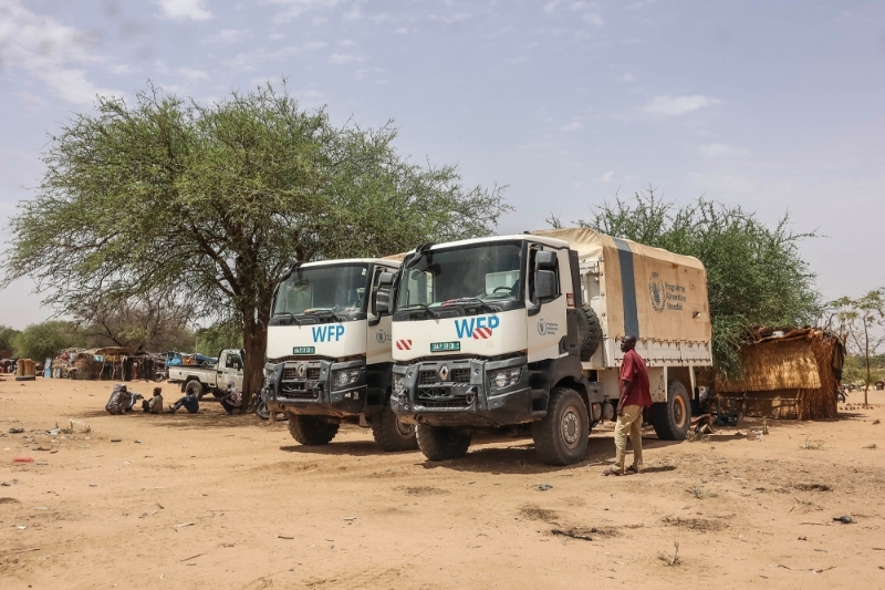 WFP trucks by shelters for Sudanese refugees from the Tandelti area who crossed into Chad, in Koufroun, 30 April 2023.