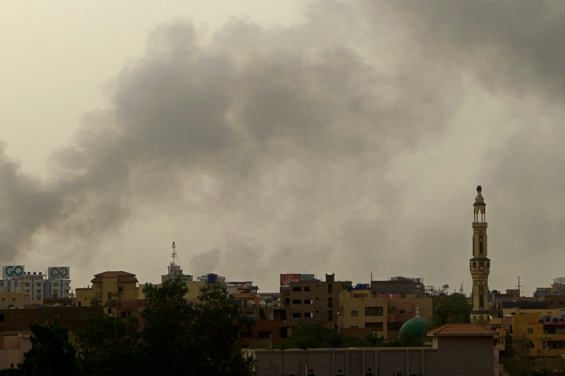 Smoke billows over buildings in southern Khartoum on 29 May 2023, amid ongoing fighting between the forces of two rival generals.